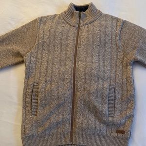 Fleece lined knitted sweater w/ full zipper. Never worn.